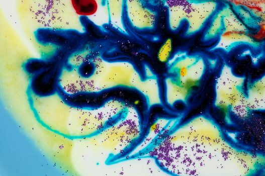 Very beautiful transparent art. An abstract work of art. Ink colors are amazingly bright, luminous, translucent, smooth. Blue and red streaks on a white background.