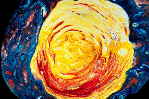 Bright blue acrylic stain with bright yellow. Marble colorful texture. A semicircle smeared with paints that looks like a celestial mantle. Abstract painting.