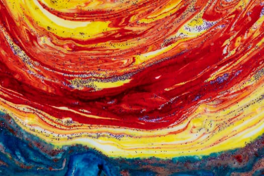 Bright blue acrylic stain with bright yellow. Marble colorful texture. A semicircle smeared with paints that looks like a celestial mantle. Abstract painting.