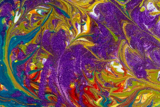 Multicolored acrylic backdrop sprinkled with purple sequins. Contemporary creativity. Colorful avant-garde texture. A background made up of many textures, shapes and materials.