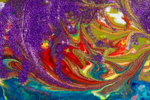 Multicolored acrylic backdrop sprinkled with purple sequins. Contemporary creativity. Colorful avant-garde texture. A background made up of many textures, shapes and materials.