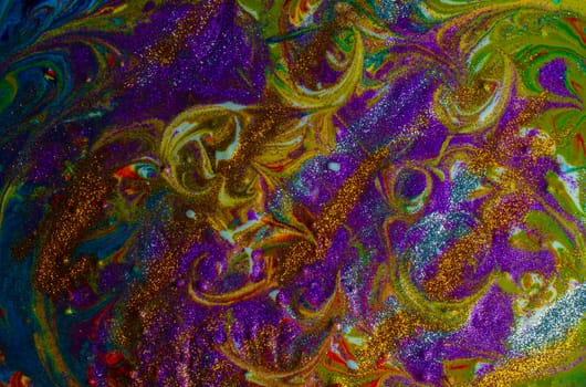 Multicolored acrylic background with curls sprinkled with purple and gold sparkles. Contemporary oriental art. A colorful avant-garde painting with rich texture. A background made up of many shapes and materials.