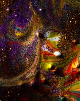 Vertically on a dark background, sprinkled with purple and gold sparkles with streaks and waves. Contemporary creativity. A colorful avant-garde painting with rich texture. A background made up of many shapes and materials.