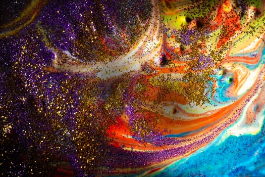 Multicolored acrylic background with curls sprinkled with purple and gold sparkles. Contemporary creativity. A colorful avant-garde painting with rich texture. A background made up of many shapes and materials.