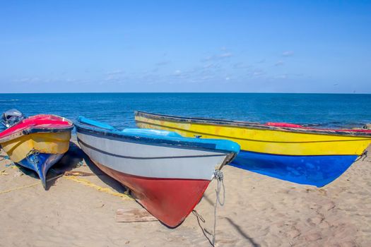 Colourful fishing boats moored on Treasure Beach, Jamaica