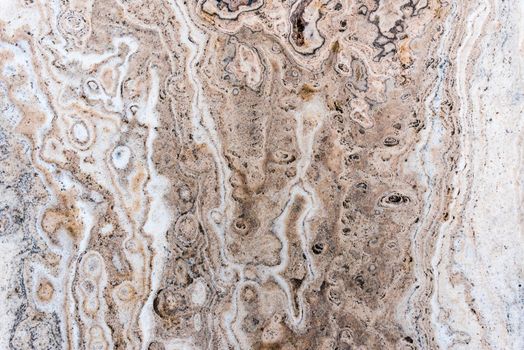 Smooth surface texture of stone, White beige or ecru color striped wave pattern of marble, Strong structure durable nature of rock for abstract background