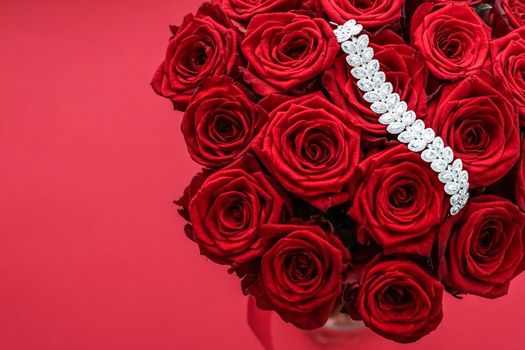 Gemstone jewellery, wedding fashion and luxe shopping concept - Luxury diamond bracelet and bouquet of red roses, jewelry love gift on Valentines Day and romantic holidays present