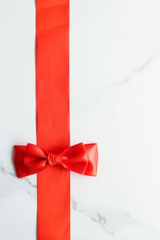 Holiday decor, feminine design and flatlay concept - Red silk ribbon on marble, top view