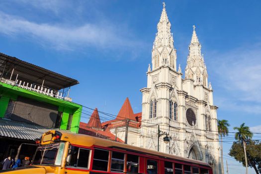 Basilica of the Sacred Heart and chicken bus in San Salvador. San Salvador, El Salvador.