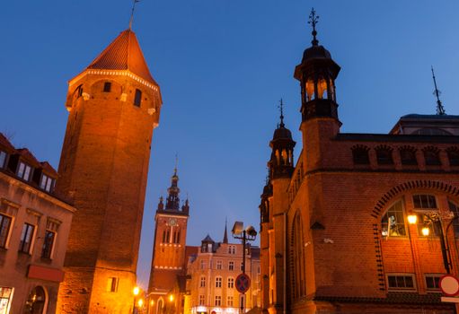 Market Hall, St Catherine  Church and St Hyacinth Tower in Gdansk at night. Gdansk, Pomerania, Poland.