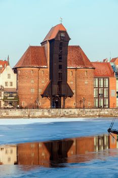 Historic crane (zuraw) in Gdansk seen at sunrise. Gdansk, Pomerania, Poland.