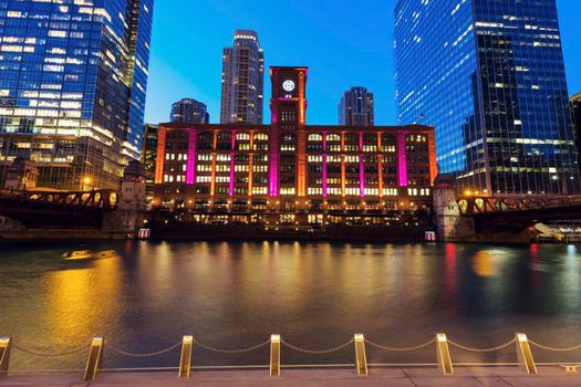 Colorful architecture of Chicago along Chicago River at night. Chicago, Illinois, USA.