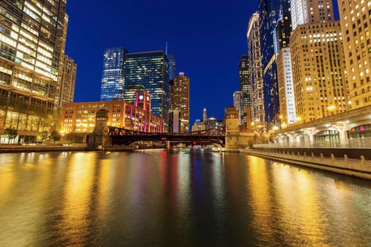 Colorful architecture of Chicago along Chicago River at night. Chicago, Illinois, USA.
