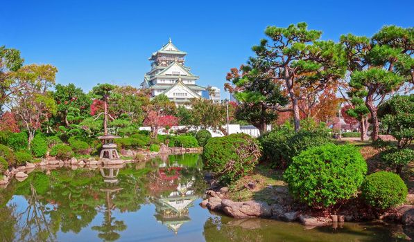 Osaka Castle in osaka city with autumn leaves