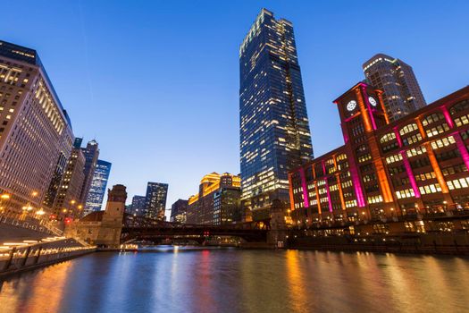 Colorful architecture of Chicago along Chicago River at night. Chicago, Illinois, USA.