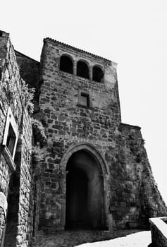 City gate Porta Santa Maria -Porta Cava -Civita di Bagnoregio in black and white , old town in central Italy situated in the valley of the badlands founded by Etruscans , it's known as La città che muore -the dying town