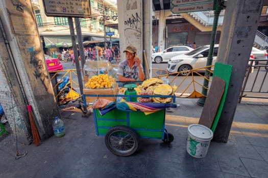 BANGKOK, THAILAND - 22 Dec 2018  : Street food, lifestyle fruit shop in Phahurat market.