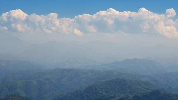 The blue sky and cloudy over the mountain in day