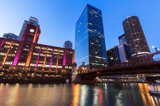 Colorful architecture of Chicago along Chicago River at night. Chicago, Illinois, USA.