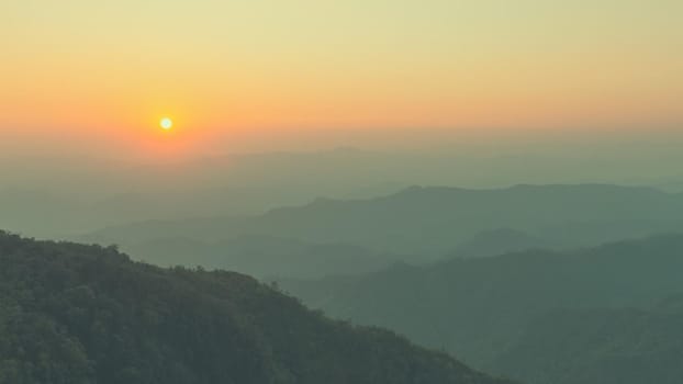 Colorful sunset in the mountains landscape. Dramatic overcast sky.