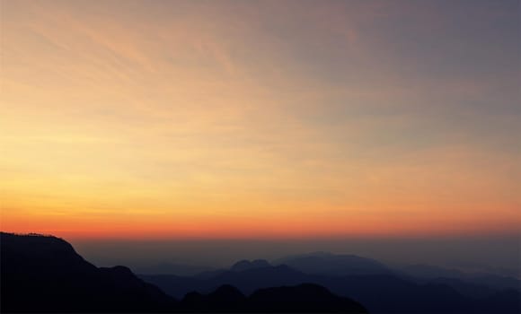 Colorful sunset in the mountains landscape. Dramatic overcast sky.