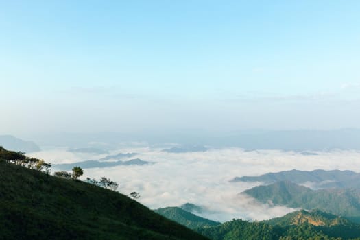 Landscape of mountain view with morning fog at sunrise time.