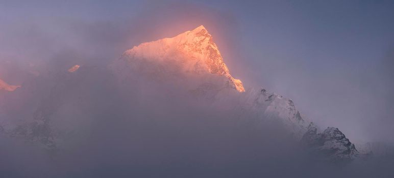 Nuptse and Everest summits at sunset or sunrise. Everest base camp trek, tourism in Nepal
