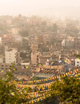 Kathmandu city view and prayer flags after sunrise. Religion in Nepal