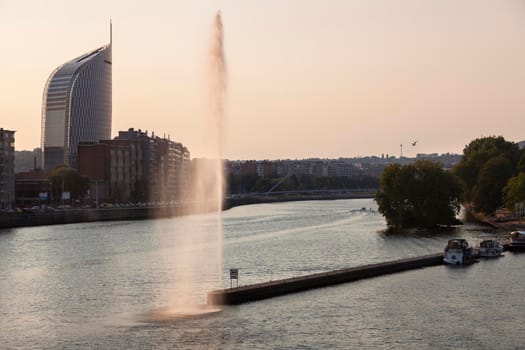 Fountain on Meuse River in Liege. Liege, Wallonia, Belgium.