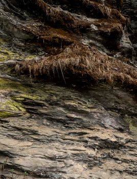 Rocks and stones texture or pattern with moss. Mountains and minerals