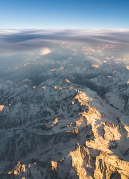 Clouds and sunset plane window view in Caucasus