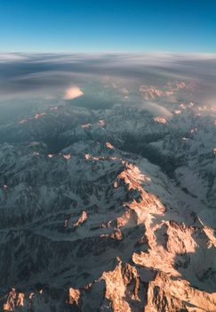 Clouds and sunset plane window view in Caucasus