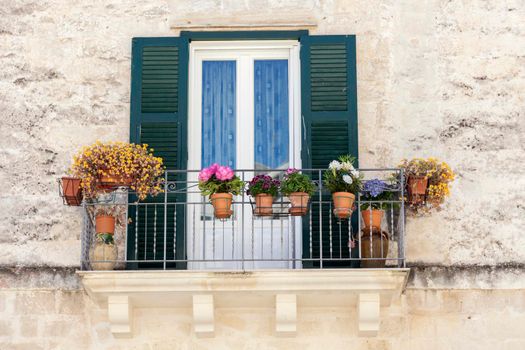 Balcony with flowers in Matera. Matera, Basilicata, Italy