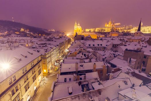 Winter in Prague - city panorama with St. Vitus Cathedral  and St. Nicholas Church. Prague, Bohemia, Czech Republic.