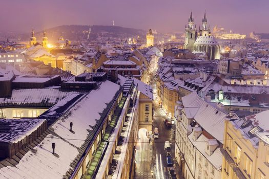 Winter in Prague - city panorama with Tyn Cathedral and Clock Tower. Prague, Bohemia, Czech Republic.