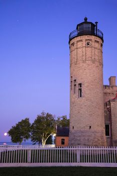 Old Mackinac Point Light Station and full moon. Mackinaw City, Michigan, USA.