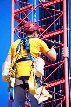 Climber ascending the 400 feet cellular tower
