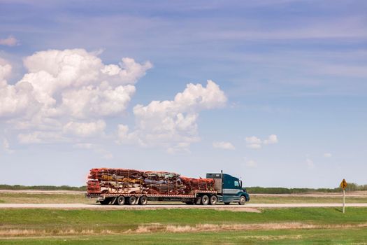 Transporting wrecked cars. Regina, Saskatchewan, Canada.