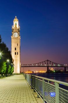 Montreal Clock Tower and Jacques Cartier Bridge. Montreal, Quebec, Canada.