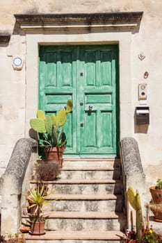 Colorful architecture of Matera - green door. Matera, Basilicata, Italy.