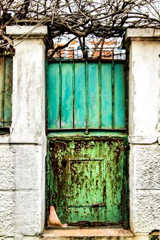Old and colorful rusty metal door in Lisbon, Portugal