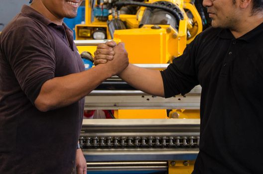 Handshake of construction worker at the construction site. Concept of teamwork