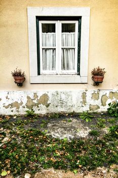 Old colorful and bright typical facade in Lisbon with beautiful vintage wooden window