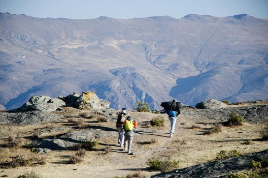 travel, tourism, hike, gesture and people concept - group of smiling friends