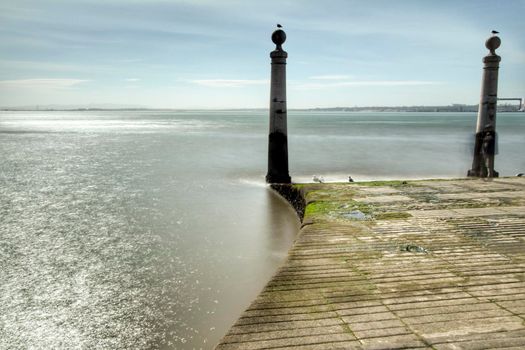 Beautiful views from Cais das Colunas and the Tagus river on a sunny day in Lisbon