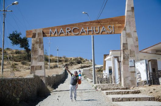 Lima, Peru - 2 SEPTEMBER 2018: Male traveler at the entrance to the road to Marcahuasi located east of the city of Lima - Peru