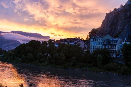 Grenoble architecture along Isere River seen at sunset. Grenoble, Auvergne-Rhone-Alpes, France.