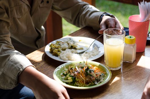 Delicious homemade food, cau cau with rice and salad, concept of homemade food