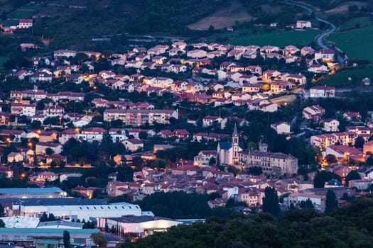 Millau panorama at night - aerial view. Millau, Occitanie, France.