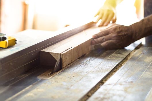Carpenter tools on wooden table with sawdust. Cutting a wooden plank